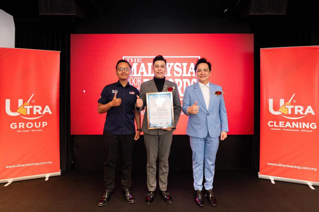 Ultra Group team receiving the Malaysia Book of Records award on stage